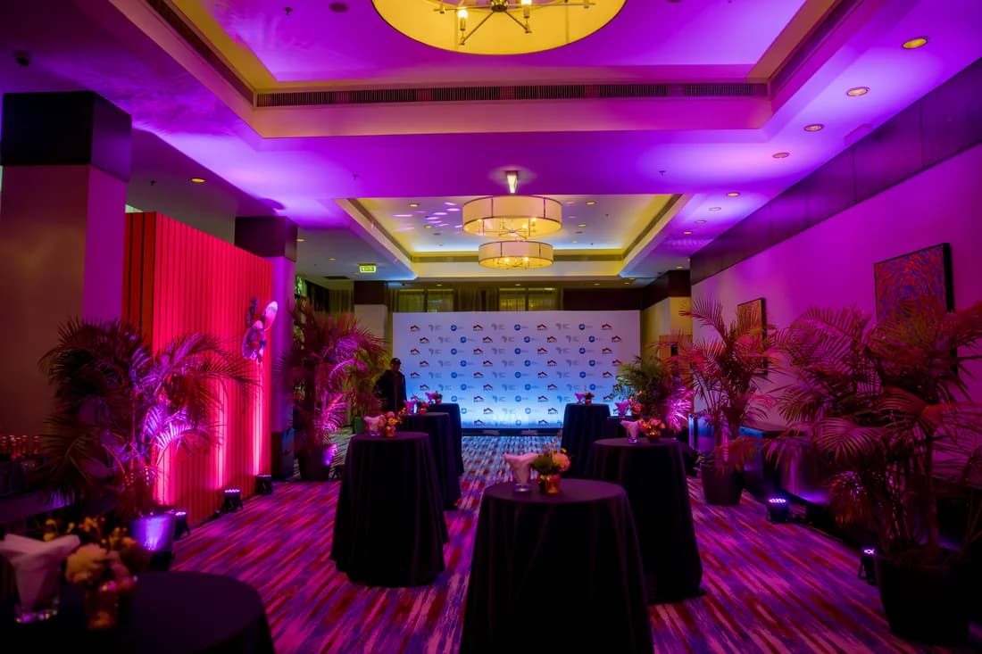 Gala dinner venue setup with stage backdrop