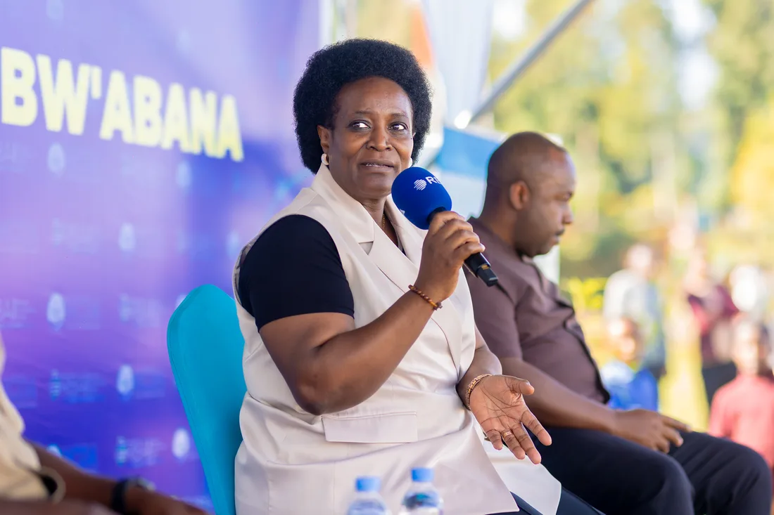 Panelists seated on stage at the Ukwezi Kw'Abana broadcast event