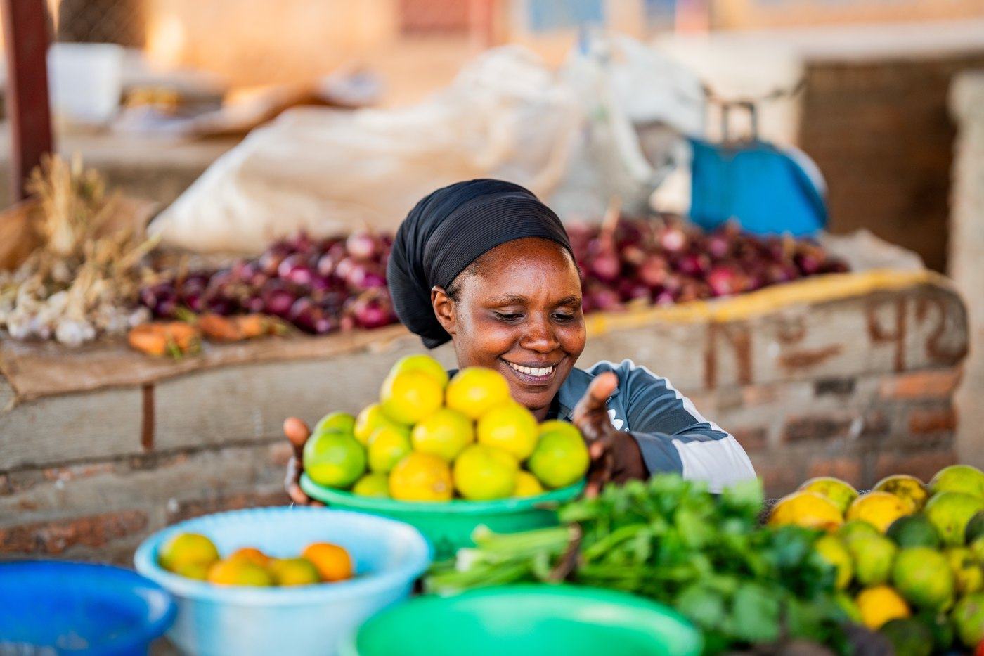 A trader at her market stall: the working day the ECD centres make possible