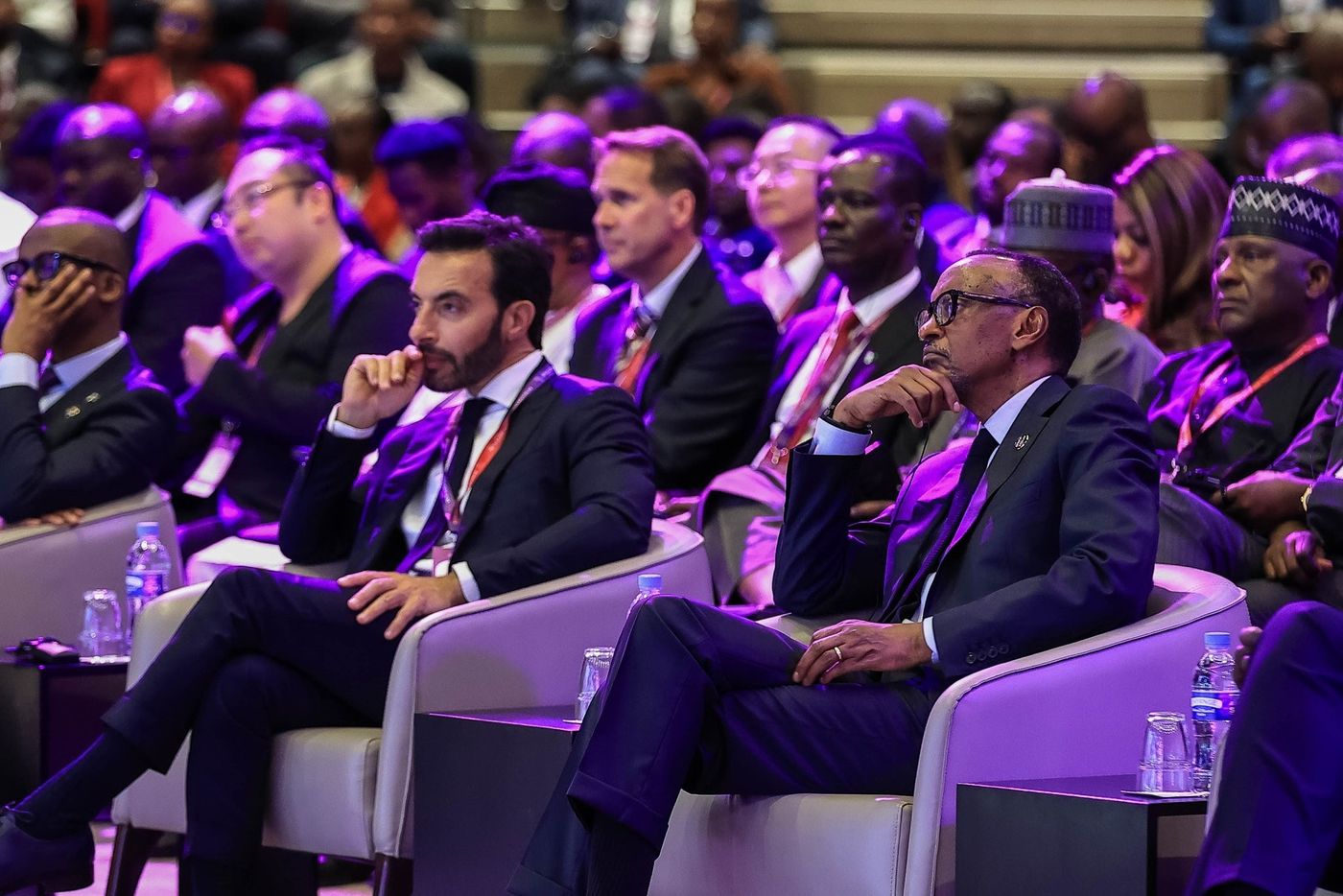 H.E. President Paul Kagame follows a plenary session.