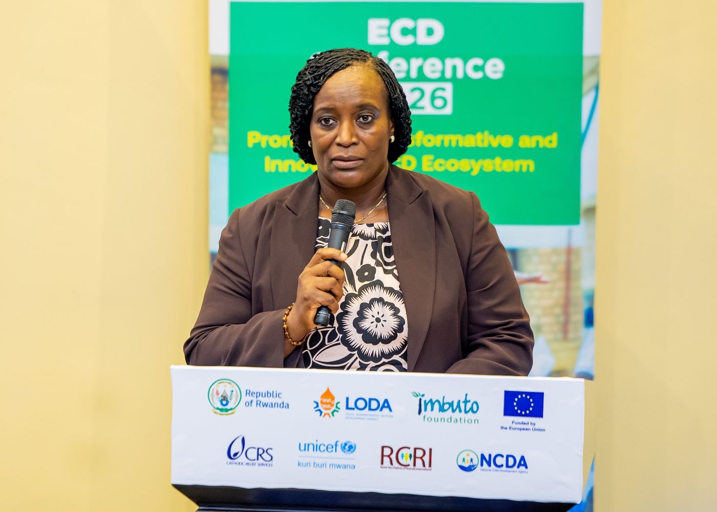 A speaker at the podium of the national early childhood development conference