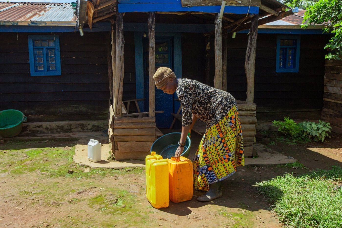 Jerrycans and a basin outside a home in Muko