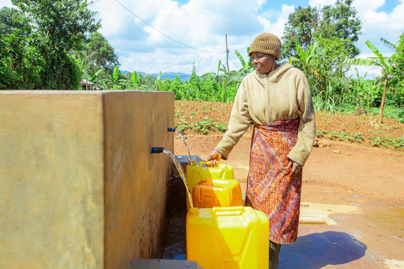 Neighbours at the tap stand, Muko