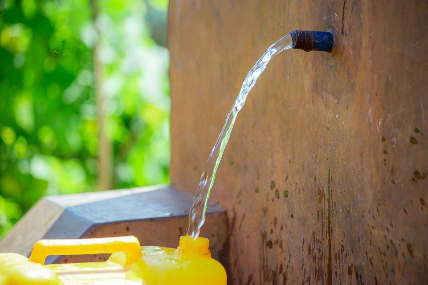 Clean water at the rebuilt tap stand in Muko, Nyamasheke District